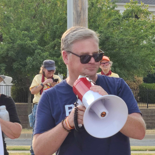 An image of Robb Ryerse with a bullhorn.